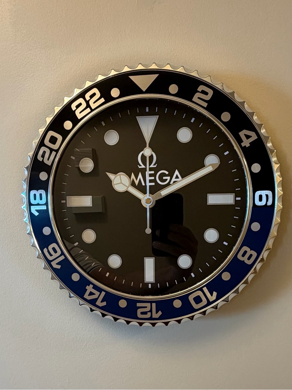 Omega Black and Blue Branded Wall Clock